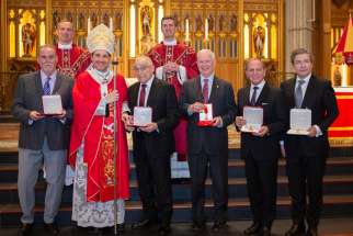 Archbishop Francis Leo (front, second from left) bestows Papal Honours to six Catholics in the Archdiocese of Toronto. From left Michael Fullan, John Gennaro, James Milway, Joseph Mancinelli, Anthony Primerano. Silvija Vigeon was also honoured but is absent from the photo. Also pictured in the back row are Fr. Portelli, left, rector of the Cathedral and Fr. Curtis, Chancellor of Spiritual Affairs.