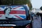 The rear window of a cab with the image of Queen Elizabeth II is pictured parked near Buckingham Palace in London Sept. 8, 2022, as people gather after the announcement that Britain&#039;s longest-reigning monarch and the nation&#039;s figurehead for seven decades died at the age of 96.
