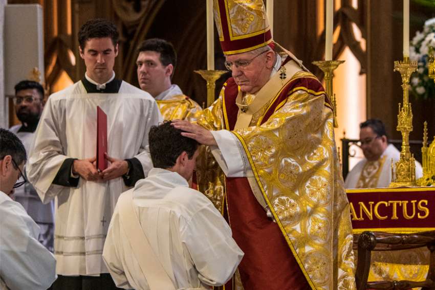 Thomas Cardinal Collins ordained four men to the priesthood, May 14, 2022.
