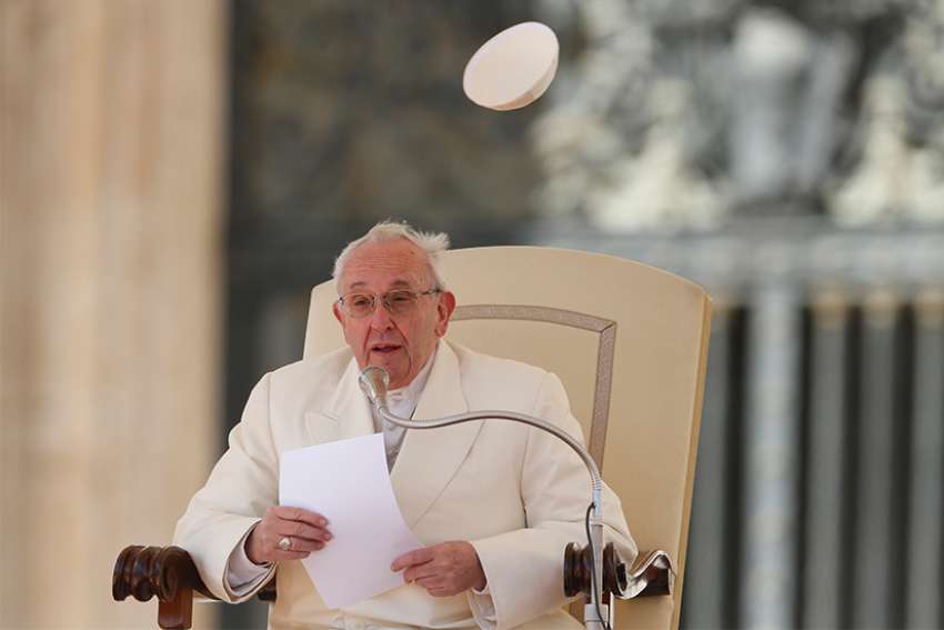  Pope Francis&#039; zucchetto is blown away by a gust of wind during his general audience in St. Peter&#039;s Square at the Vatican March 21.