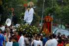 Worshippers carry a statue of the risen Christ during an Easter procession in Escazu, Costa Rica, April 8, 2012.