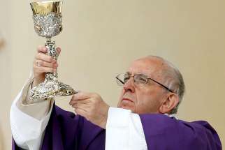  04.03.2017 Pope Francis elevates the chalice as he celebrates Mass in Carpi, Italy, April 2.