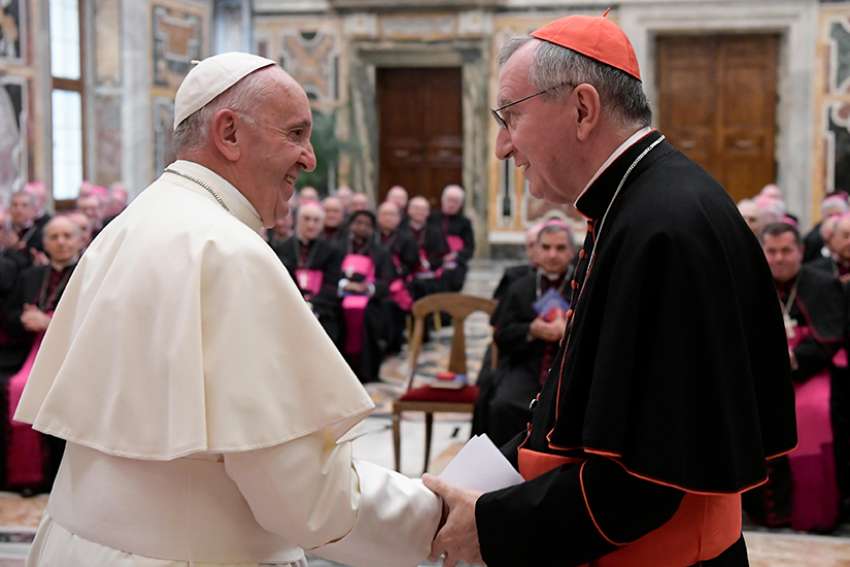 Pope Francis greets Cardinal Pietro Parolin, Vatican secretary of state, during a meeting with nuncios, who represent the Pope around the world, in the Apostolic Palace at the Vatican Sept. 17, 2016.