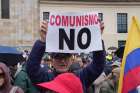 A protesters holds a sign saying &quot;No to Communism&quot; during a rally against Colombian President Gustavo Petro&#039;s security policies in Bogotá July 19, 2023.