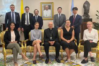 Interns in the diplomatic corps of the Holy See’s Permanent Observer Mission at the United Nations, including Canadian Max Yun, back row right, with nuncio Archbishop Gabriele Caccia.