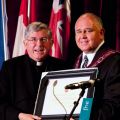 Cardinal Collins was presented with a commemorative scroll by Markham Mayor Frank Scarpitti as the recently-declared city celebrated its religious diversity July 17th.