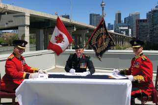 Lt. Col. Joseph Nonato, seated far left, hands over command of the Royal Regiment of Canada to Lt.-Col. Peter Martinis, right, in a May 30 ceremony presided over by Col. John McEwen.