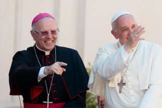 Bishop Nunzio Galantino, now president of the Administration of the Patrimony of the Holy See, is pictured with Pope Francis during the pope&#039;s visit to Cassano allo Ionio, Italy, in this June 21, 2014, file photo. In an Oct. 31 interview with the newspaper Avvenire, Bishop Galantino said investments by the Vatican&#039;s Secretariat of State are now under tighter control.