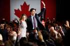 Liberal Party leader winner Justin Trudeau and his wife Sophie Gregoire wave during victory speech in Montreal, Oct. 19.