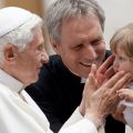 Pope Benedict XVI greets a baby as he leaves his general audience in St. Peter&#039;s Square at the Vatican May 23. Also pictured is Msgr. Georg Ganswein, the pope&#039;s personal secretary.