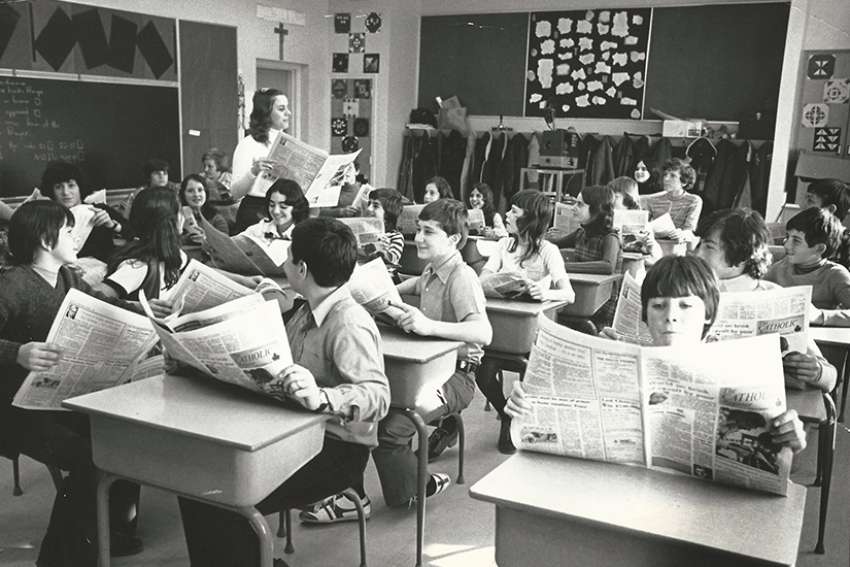 Schoolchildren read The Catholic Register in undated photo. 