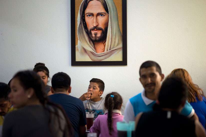 A young boy from the Mexican state of Guerrero eats dinner with his family at the Casa del Migrante shelter in Tijuana. The family is part of a growing wave of people from several states in southern Mexico who have fled violence and who hope to seek asylum in the U.S. Since late May, more than a thousand migrants from around the world have have shown up in Tijuana. 
