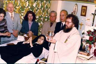 Fr. Claudio Piccinini celebrates Mass in 1977 in an all-purpose room in the Toronto hospital where Sr. Carmelina Tarantino professed her vows as the first Passionist Sister in Toronto. 