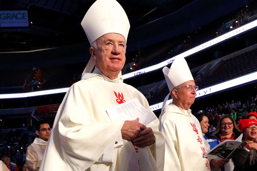 Bishop Michael J. Bransfield of Wheeling-Charleston, W.Va, center, processes at the beginning of a pro-life youth Mass in 2016 at the Verizon Center in Washington.