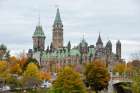 Flags fly at half-mast on the Canadian Parliament buildings in Ottawa, Ontario, Oct. 23. Cpl. Nathan Cirillo, a Canadian soldier, was shot and killed while on duty at the nearby National War Memorial.