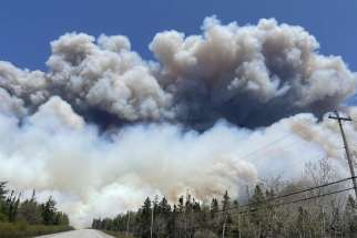 Smoke from a wildfire near Barrington Lake in Nova Scotia fills the skies. Halifax-Yarmouth Archbishop Brian Dunn said the archdiocese will continue to support those affected and a special litany prayer was composed for those affected by the fires.