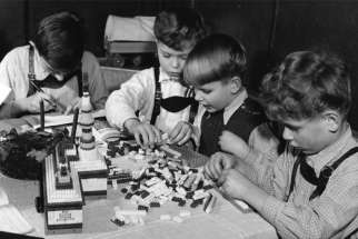 Boys play with Legos at a Catholic orphanage in Bonn, Germany, during Advent in 1960. The number of German children in orphanages surged after World War II. The Diocese of Hildesheim is investigating reports that many children in these homes were victims of sexual abuse by clergy. 