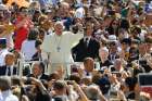 Pope Francis waves as he arrives to lead his general audience in St. Peter&#039;s Square at the Vatican June 17. 