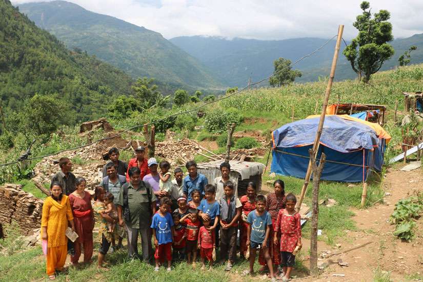 Catholic families stand in front of home on Kyaltung Mountain in Sindhupalchowk, Nepal, July 12.