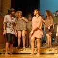 Cast members of The Other Side of the River act out a scene from the play, a Romeo-and-Juliet-like portrayal of poverty. The musical was presented four times in June at St. Thomas Aquinas Secondary School.
