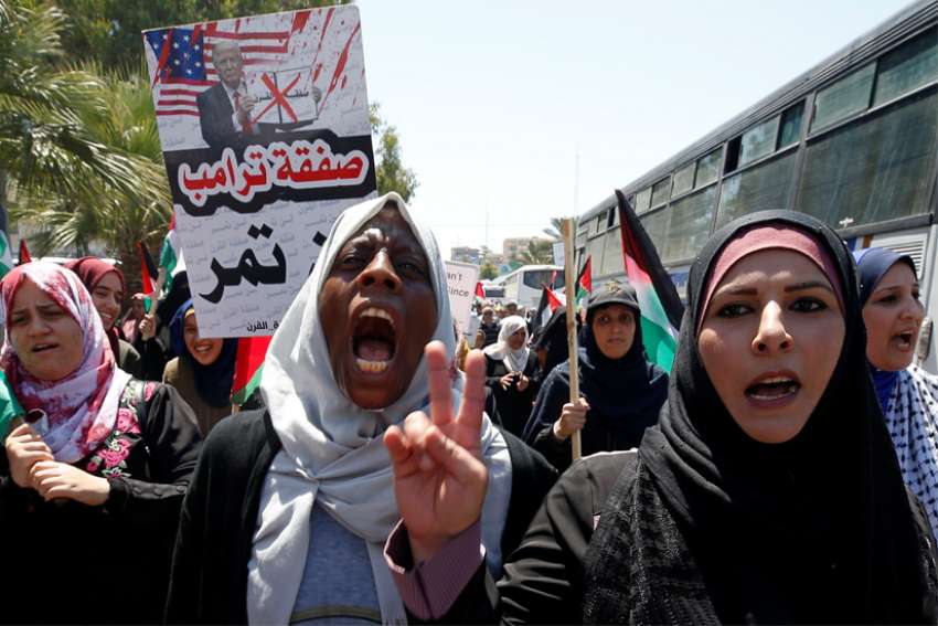 Demonstrators take part in a rally in Gaza City July 1, 2020, as Palestinians called for a &quot;day of rage&quot; to protest Israel&#039;s plan to annex parts of the Israeli-occupied West Bank.