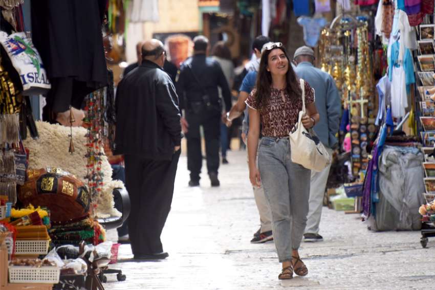 Tourists walks by souvenir shops in Jerusalem&#039;s Old City April 3, 2022.