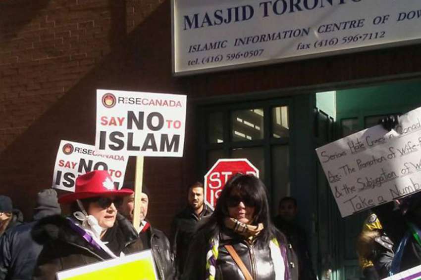 More than a dozen anti-Muslim protesters gathered outside a downtown Toronto mosque Feb. 17.