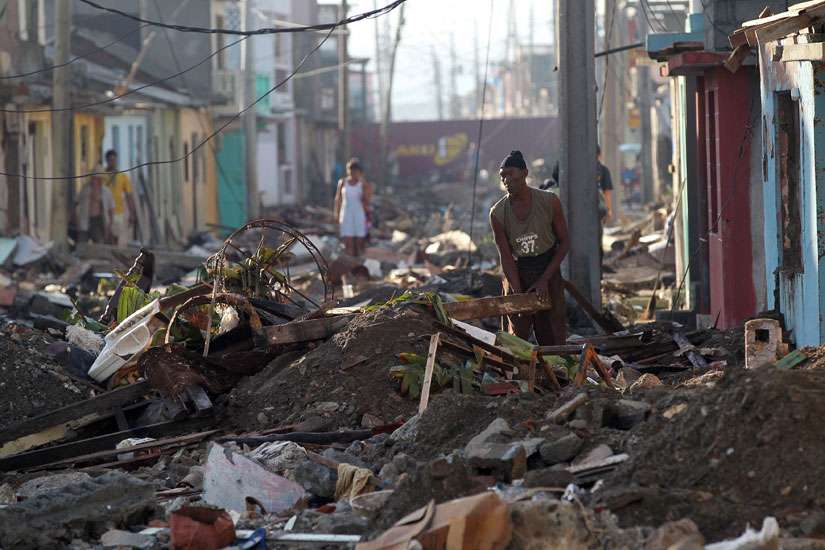 People search for belongings Oct. 7 in the devastation caused by Hurricane Matthew in Baracoa, Cuba. The powerful hurricane left serious damage at the eastern end of the island, with landslides, toppling electricity poles and cutting off roads by flooding.