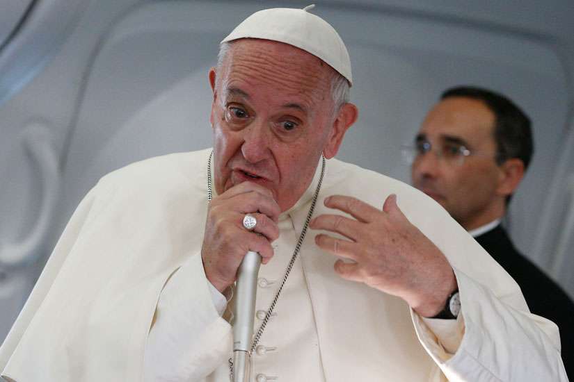 Pope Francis speaks with journalists aboard his July 31 flight from Krakow, Poland, to Rome.