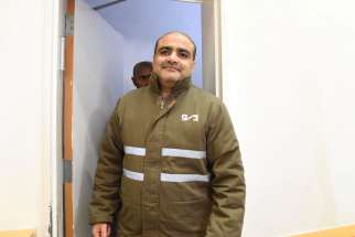 Palestinian Mohammad El Halabi, front, a manager of operations in the Gaza Strip for U.S.-based Christian charity World Vision, is seen before a hearing at the Beersheba district court in southern Israel on Aug. 4, 2016. Halabi is accused by Israel of funneling millions of dollars in aid money to Hamas in Gaza, a charge denied by the Islamist militant group.