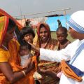 ister Leo Therese, a member of the Missionaries of Charity, greets Majoni Bibi, holding her child at a refugee camp in early October in Basagaon, India. This year, Christians around the world are being asked to learn about unity from India
