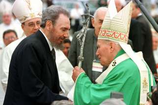 Pope John Paul II greets Cuban President Fidel Castro at the end of Mass in the Plaza of the Revolution in Havana Jan. 25, 1998.