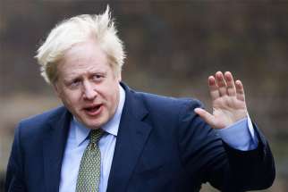 British Prime Minister Boris Johnson waves after meeting with Queen Elizabeth in London to ask for permission to form a government Dec.13, 2019. In the Dec. 12 general election, Johnson&#039;s Conservatives won a majority of 80 seats, the largest for his party since Margaret Thatcher won a third term in 1987.