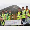 Young people from Ireland pose with a banner after carrying the International Eucharistic Congress Bell up to the summit of Croagh Patrick for Reek Sunday in Ireland May 28. The 2012 International Eucharistic Congress will be held in Dublin June 10-17. 