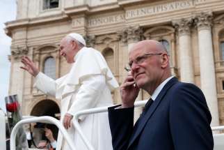Domenico Giani, lead bodyguard for Pope Francis and head of the Vatican police force, keeps watch as the pope leaves his general audience in St. Peter&#039;s Square at the Vatican May 1, 2019. Pope Francis accepted the resignation of Giani Oct. 14, nearly two weeks after an internal security notice was leaked to the Italian press.