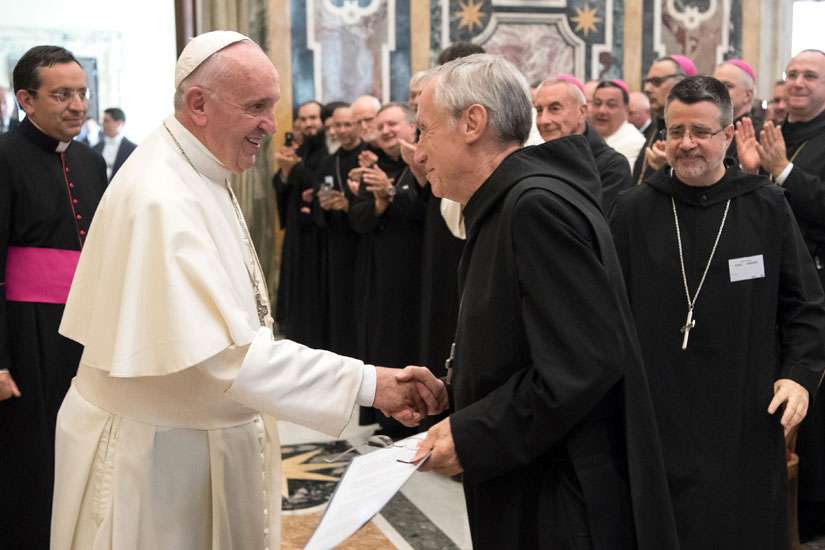 Pope Francis greets Abbot Primate Notker Wolf, superior of the Benedictine order, during a meeting with the heads of Benedictine monasteries from around the world at the Vatican Sept. 8. The Benedictines are meeting in Rome Sept. 3-16 to elect a new abbot primate.