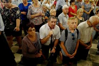 Worshippers pray during celebrations on the feast of the Assumption, Aug. 15, 2018, at Jasna Gora Monastery in Czestochowa, Poland. The Vatican secretary of state praised the Polish church&#039;s traditional closeness to Rome as key to its survival under hostile regimes, in a speech marking the centenary of the nation&#039;s conference of bishops and diplomatic ties with the Vatican. 