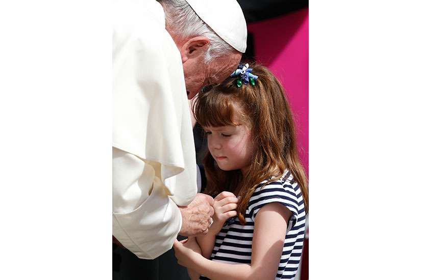 Pope Francis greets Lizzy Myers of Mansfield, Ohio, during his general audience in St. Peter&#039;s Square at the Vatican April 6. Myers, who has a disease that is gradually rendering her blind and deaf, met the Pope as part of her &quot;visual bucket list.&quot;