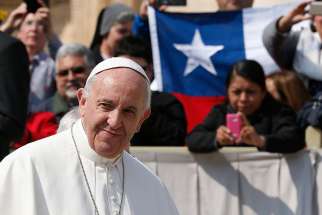 Chile&#039;s national flag is seen as Pope Francis leads his general audience in St. Peter&#039;s Square at the Vatican April 5. The Vatican announced the pope will visit Chile Jan. 15-18 and Peru Jan. 18-21.