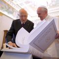 Pope Francis looks over a book with Italian President Giorgio Napolitano during a private meeting at the Vatican June 8.