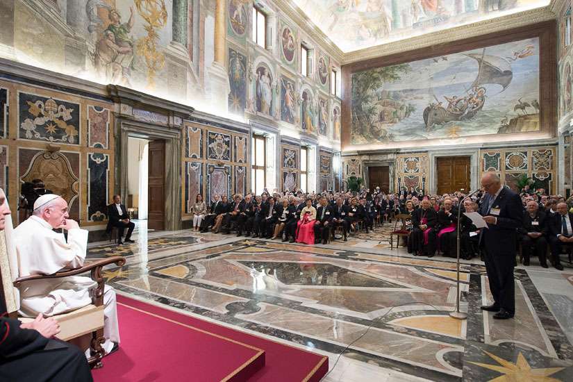 Pope Francis listens as Domingo Sugranyes Bickel, president of the Centesimus Annus Pro Pontifice Foundation, speaks during an audience with business leaders and Catholic social teaching experts at the Vatican May 13. Those at the audience were attending a conference sponsored by the foundation. 