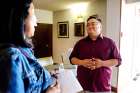 Chico Nuguid, the full-time youth minister at Precious Blood Parish in Toronto, is questioned by a parent parisher interested in sending her child to the summer camp he will be running at the younger part of the congregation. 
