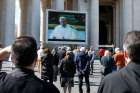 Pope Francis is pictured on a video monitor in St. Peter&#039;s Square as he leads the Angelus from his library in the Apostolic Palace at the Vatican March 8, 2020. As a precaution to avoid spread of the coronavirus, the pope&#039;s Sunday Angelus was broadcast on television and displayed on monitors in St. Peter&#039;s Square. After leading the Angelus through video the pope said he wanted to see the crowd in &quot;real time&quot; and came to the window of his studio to greet people in the square. 