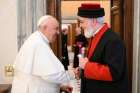 Pope Francis shakes hands with Catholicos Awa III, patriarch of the Assyrian Church of the East, at the end of a meeting Nov. 19, 2022, in the library of the Apostolic Palace at the Vatican.