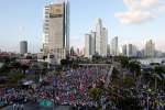 Pilgrims gather along the Cinta Costera area of Panama City during the opening Mass of World Youth Day Jan. 22, 2019.