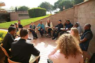 Young people talk during a conference in Rome April 6. The conference was in preparation for next year’s Synod of Bishops on young people, the faith and vocational discernment and World Youth Day in 2019.