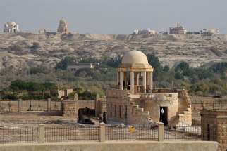 Churches stand on the hill in Jordan behind the Franciscan Chapel of St. John The Baptist at Qasr al-Yahud, on the West Bank of the Jordan River. The bullet-marked chapel was returned to the Franciscan Custody of the Holy Land after being closed by the Israelis in 1967 because of land mines.