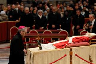 Archbishop Georg Gänswein, who was private secretary to Pope Benedict XVI, pays his respects at the body of the late pope in St. Peter&#039;s Basilica at the Vatican Jan. 2, 2023.