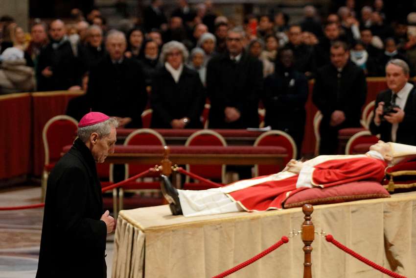 Archbishop Georg Gänswein, who was private secretary to Pope Benedict XVI, pays his respects at the body of the late pope in St. Peter&#039;s Basilica at the Vatican Jan. 2, 2023.