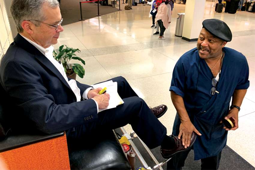 Wayne Kendrick has shined shoes at Louis Armstrong International Airport in New Orleans for 35 years and shares his Catholic faith with customers and co-workers.